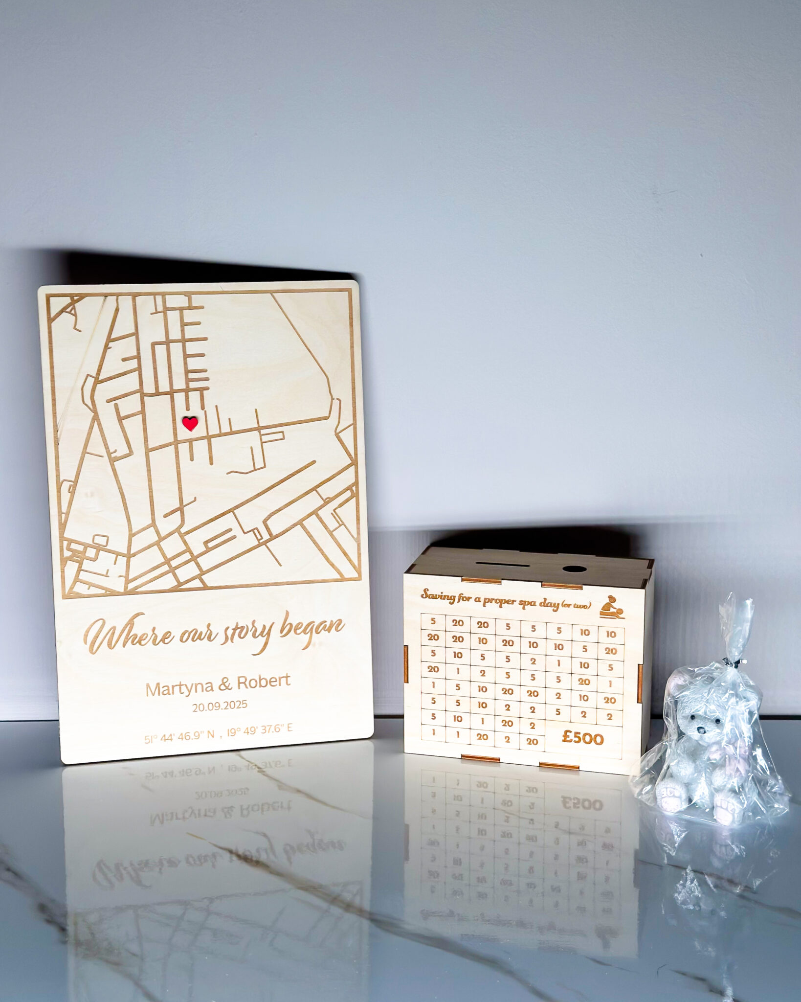 Map Plaque and Money Box on Table